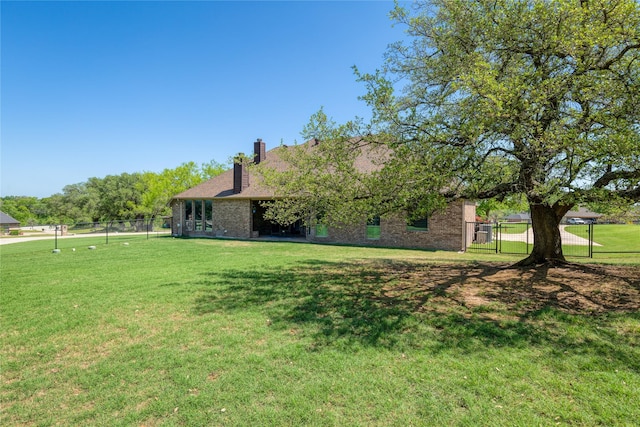 view of patio with a fenced backyard, ceiling fan, and an outdoor stone fireplace