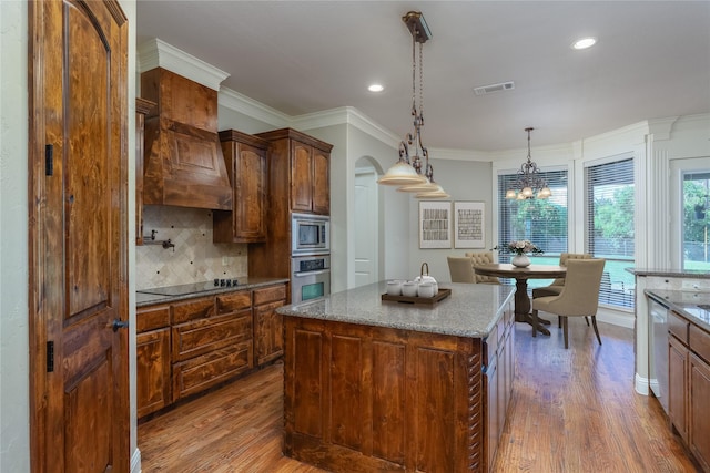 100 Meadow Arbor Dr, Weatherford, TX 76085 - kitchen with stainless steel appliances, arched walkways, wood finished floors, decorative backsplash, and recessed lighting