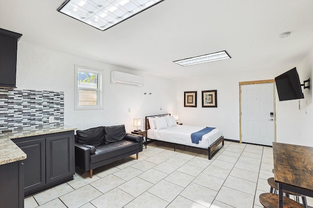 bedroom featuring light tile patterned flooring and a wall unit AC