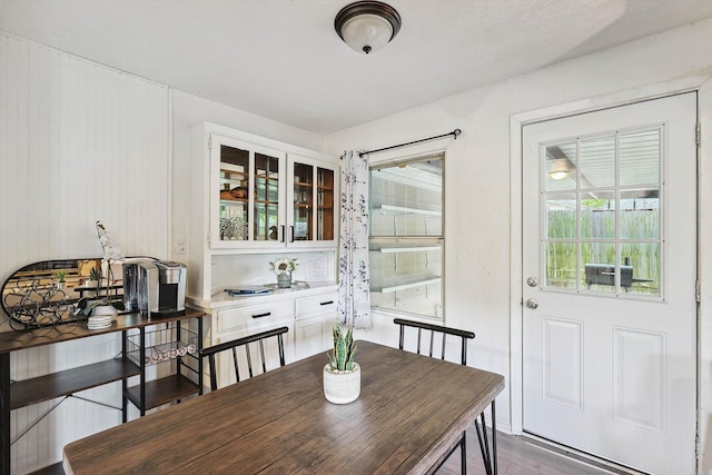 dining space with wood finished floors