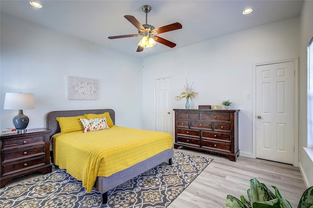 bedroom with baseboards, a ceiling fan, wood finished floors, and recessed lighting