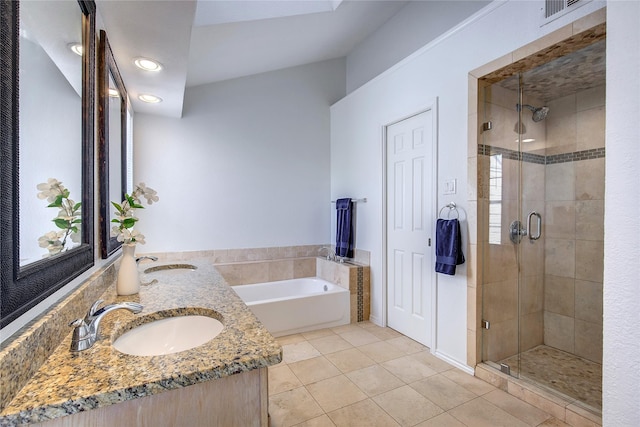 full bath featuring tile patterned floors, a sink, a stall shower, a bath, and visible vents