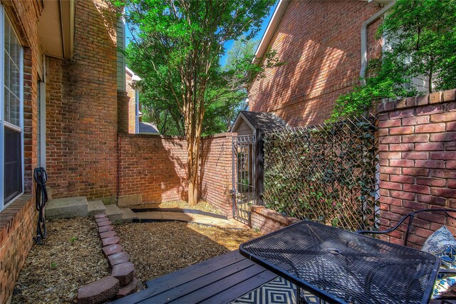 view of yard with fence and a gate