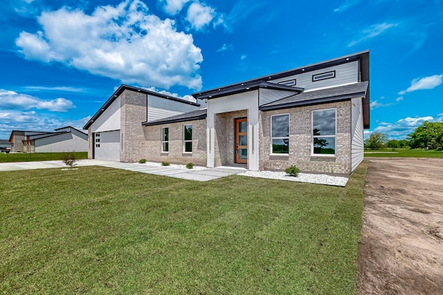 1652 County Road 3517, Quinlan, TX 75474 - modern home with concrete driveway, an attached garage, a front lawn, and brick siding