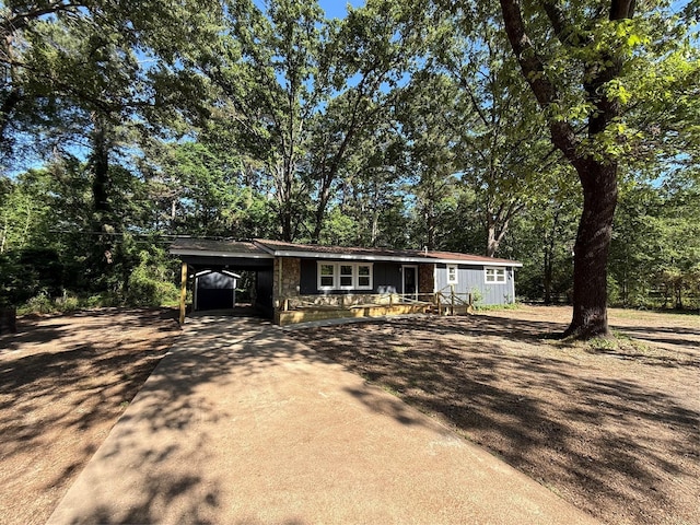 369 County Road 2119, Quitman, TX 75783 - view of front facade with concrete driveway and an attached carport