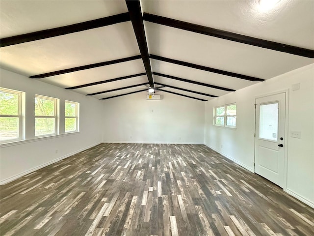 369 County Road 2119, Quitman, TX 75783 - unfurnished living room with wood finished floors, vaulted ceiling with beams, and baseboards