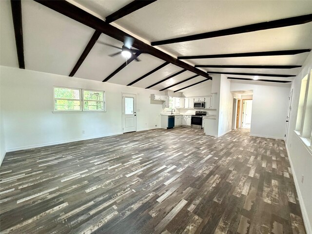 369 County Road 2119, Quitman, TX 75783 - unfurnished living room with wood finished floors, vaulted ceiling with beams, baseboards, and ceiling fan