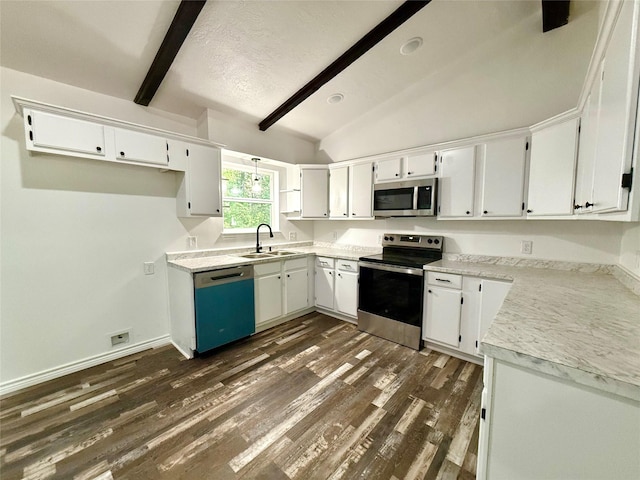 369 County Road 2119, Quitman, TX 75783 - kitchen featuring stainless steel appliances, vaulted ceiling with beams, a sink, dark wood-type flooring, and white cabinetry