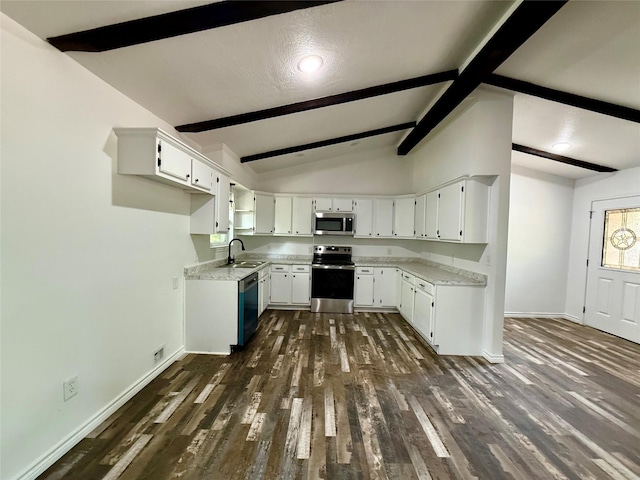 369 County Road 2119, Quitman, TX 75783 - kitchen with stainless steel appliances, dark wood-style floors, vaulted ceiling with beams, baseboards, and light countertops