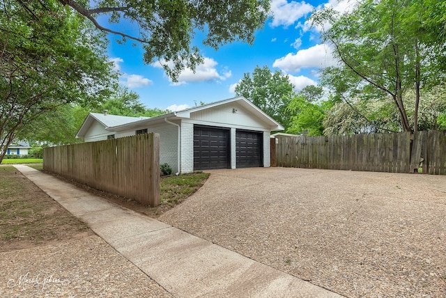 garage featuring fence