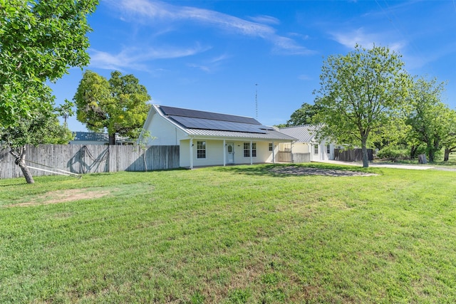 13122 Lipan Hwy, Lipan, TX 76462 - rear view of house with fence, a lawn, and solar panels