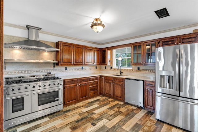 13122 Lipan Hwy, Lipan, TX 76462 - kitchen featuring light countertops, wall chimney exhaust hood, stainless steel appliances, and a sink