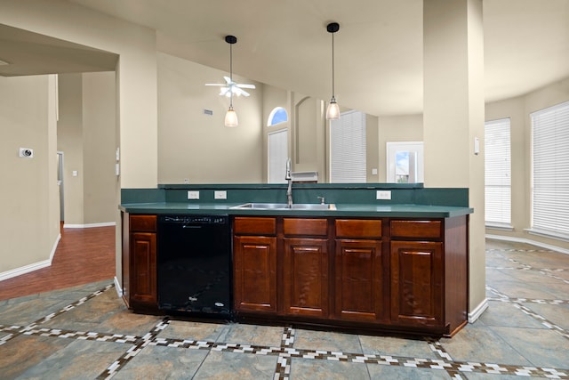 kitchen featuring a ceiling fan, a sink, decorative light fixtures, baseboards, and black dishwasher