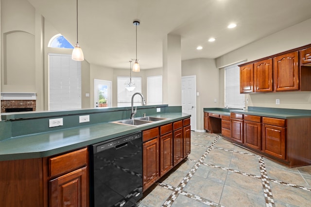 kitchen with dark countertops, black dishwasher, and a sink
