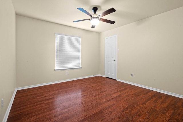 unfurnished room with ceiling fan, baseboards, and dark wood-style flooring