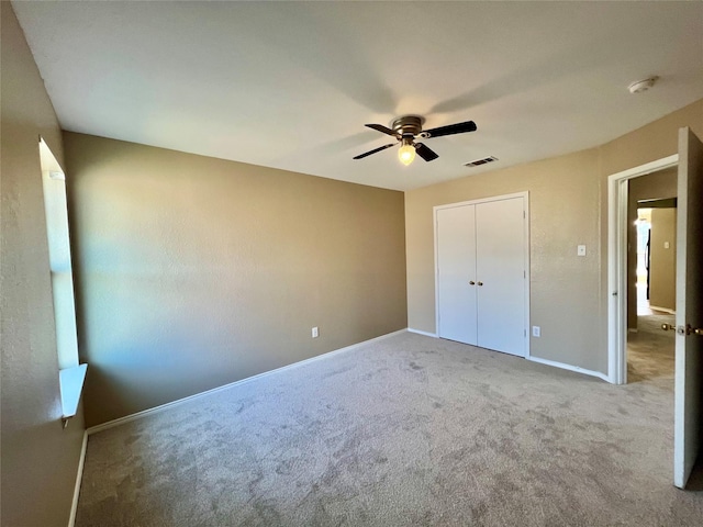 525 Reagan Ln, Burleson, TX 76028 - unfurnished bedroom with a closet, ceiling fan, carpet, baseboards, and visible vents