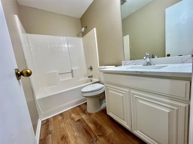 525 Reagan Ln, Burleson, TX 76028 - full bath with shower / bath combination, wood finished floors, vanity, and toilet