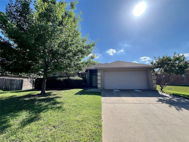 525 Reagan Ln, Burleson, TX 76028 - view of front of property with brick siding, driveway, and a front yard