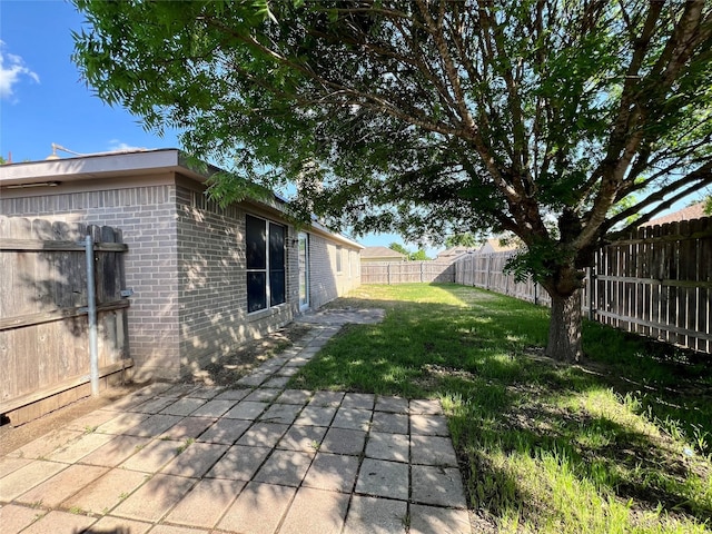 525 Reagan Ln, Burleson, TX 76028 - view of yard featuring a fenced backyard and a patio