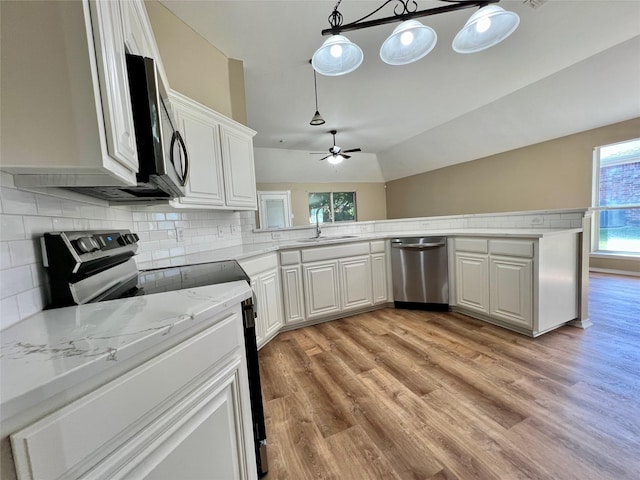 525 Reagan Ln, Burleson, TX 76028 - kitchen featuring a ceiling fan, a sink, light wood finished floors, white cabinetry, and appliances with stainless steel finishes
