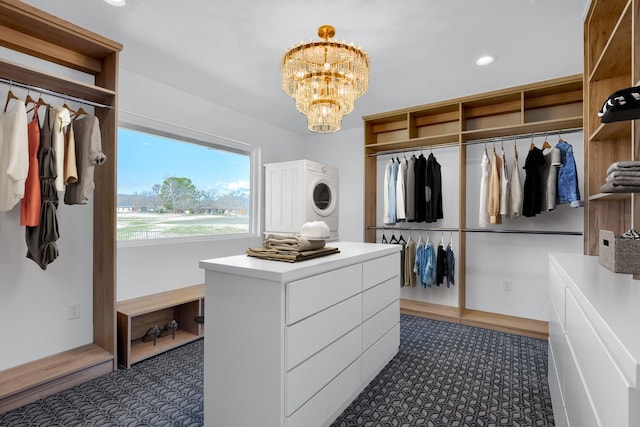 walk in closet featuring a chandelier and carpet flooring