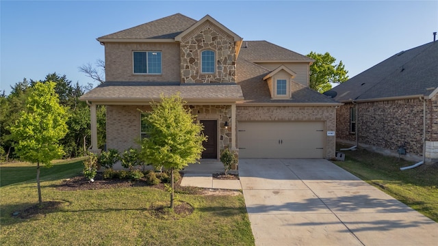 traditional-style home with stone siding, driveway, a front lawn, and brick siding