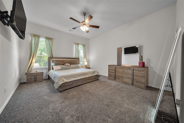 bedroom with visible vents, baseboards, carpet flooring, and ceiling fan