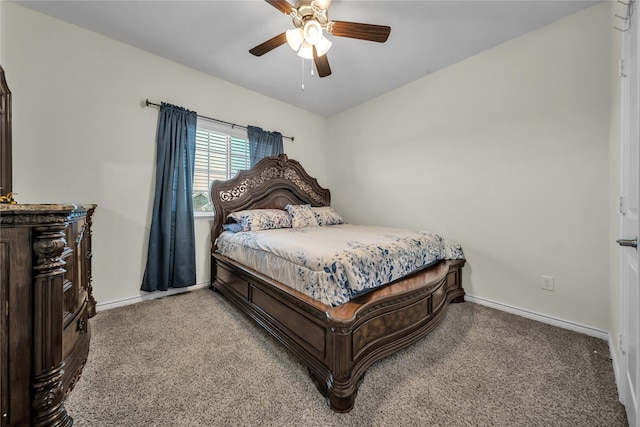bedroom with a ceiling fan, baseboards, and carpet