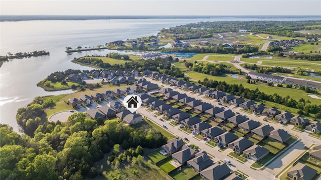 drone / aerial view featuring a residential view and a water view