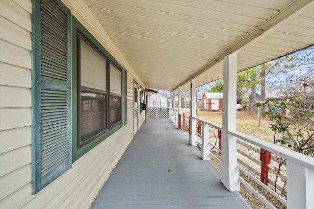 view of patio with an outbuilding and a storage shed