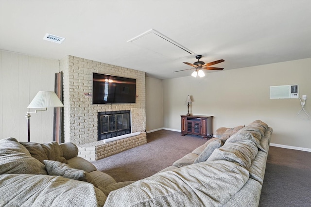 living area with a ceiling fan, attic access, visible vents, baseboards, and carpet flooring