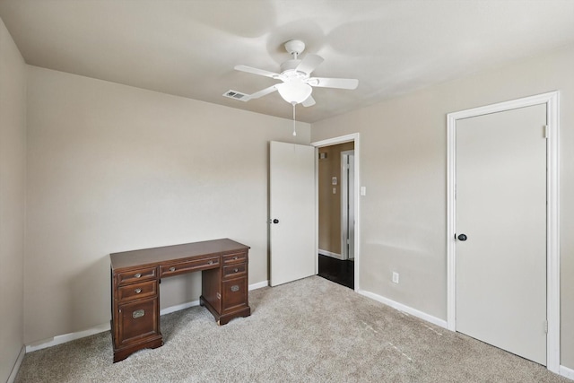 unfurnished bedroom with visible vents, carpet flooring, baseboards, and ceiling fan