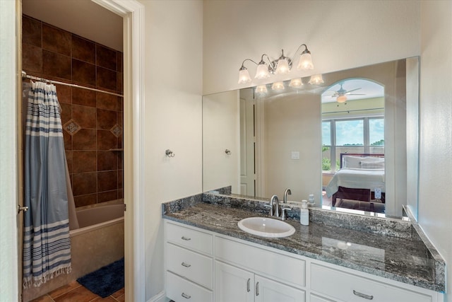 full bathroom with shower / bath combo, a ceiling fan, tile patterned flooring, vanity, and connected bathroom
