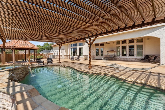 view of swimming pool featuring a ceiling fan, fence, a patio area, french doors, and a gazebo