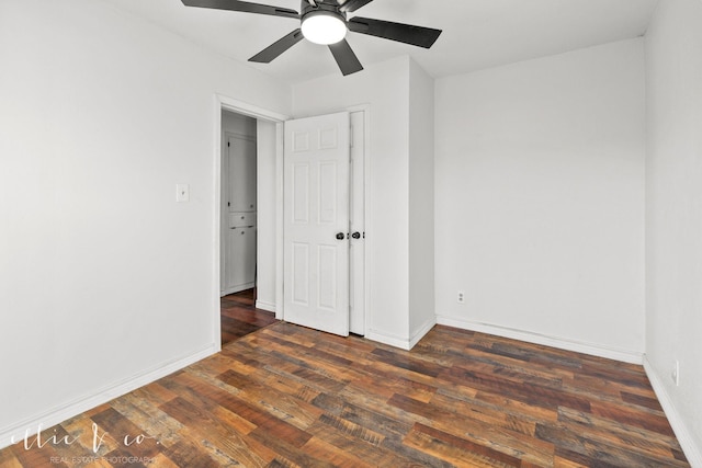 unfurnished bedroom featuring wood finished floors, baseboards, and ceiling fan