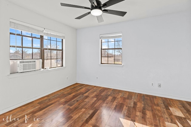 unfurnished room featuring baseboards, hardwood / wood-style flooring, a ceiling fan, and cooling unit