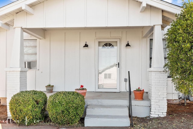 doorway to property with board and batten siding