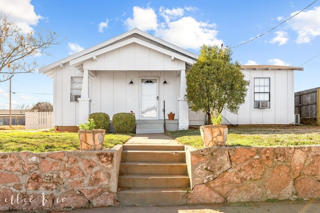 single story home with fence
