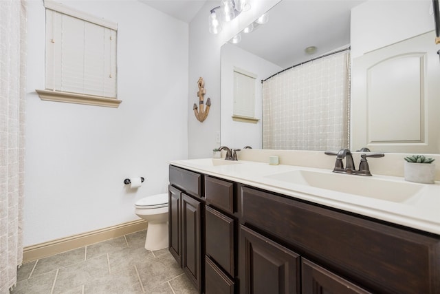 7512 Sabine Dr, Mckinney, TX 75071 - bathroom featuring toilet, baseboards, double vanity, and a shower with shower curtain