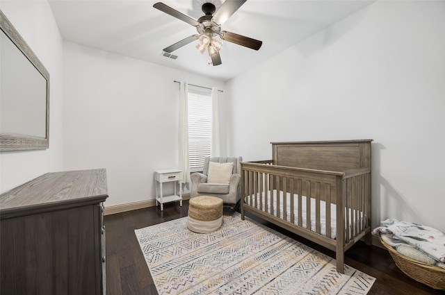 7512 Sabine Dr, Mckinney, TX 75071 - bedroom with wood-type flooring, a ceiling fan, a nursery area, and baseboards