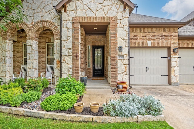7512 Sabine Dr, Mckinney, TX 75071 - doorway to property with driveway, brick siding, stone siding, and a shingled roof
