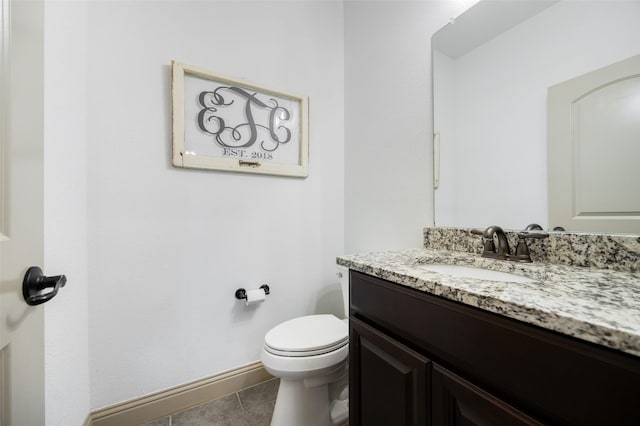 7512 Sabine Dr, Mckinney, TX 75071 - half bathroom with vanity, toilet, baseboards, and tile patterned floors