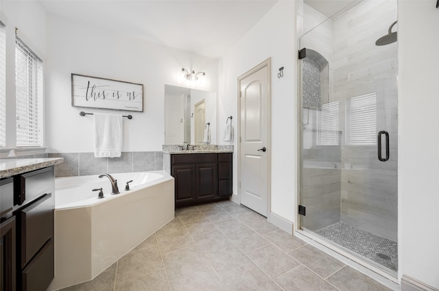 7512 Sabine Dr, Mckinney, TX 75071 - bathroom with a shower stall, a bath, vanity, and tile patterned floors