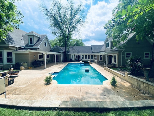 501 N Austin St, Comanche, TX 76442 - view of pool with a patio, a fire pit, and a pool with connected hot tub
