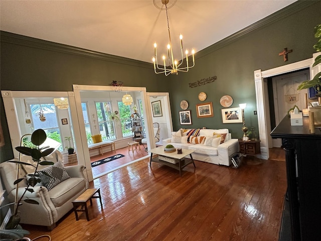 501 N Austin St, Comanche, TX 76442 - living room with hardwood / wood-style floors, a chandelier, and ornamental molding