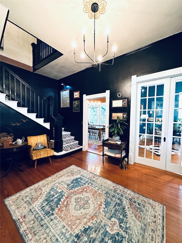 501 N Austin St, Comanche, TX 76442 - foyer entrance featuring stairway, wood finished floors, and a chandelier