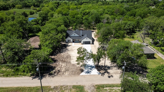 drone / aerial view with a view of trees