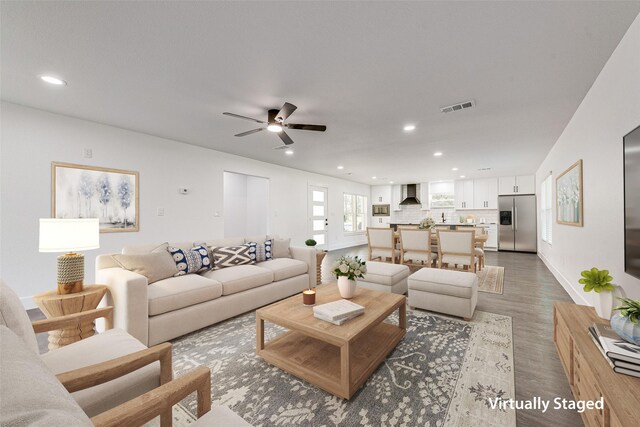 living room featuring recessed lighting, wood finished floors, ceiling fan, baseboards, and visible vents