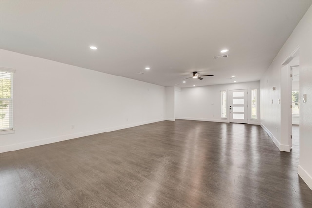 spare room with ceiling fan, baseboards, dark wood-type flooring, visible vents, and recessed lighting