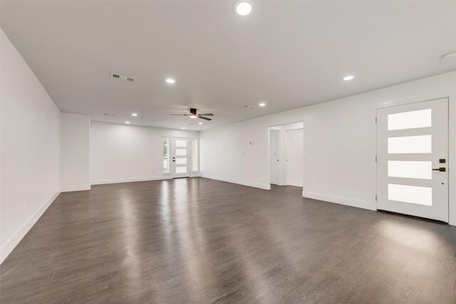 spacious closet with dark wood-style flooring